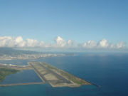 Completed in 1977, the Reef Runway is a designated alternate landing site for the National Aeronautics and Space Administration space shuttle program in association with Hickam Air Force Base, which shares Honolulu International Airport's airfield operations.